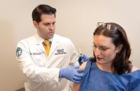 Doctor giving a patient an injection.
